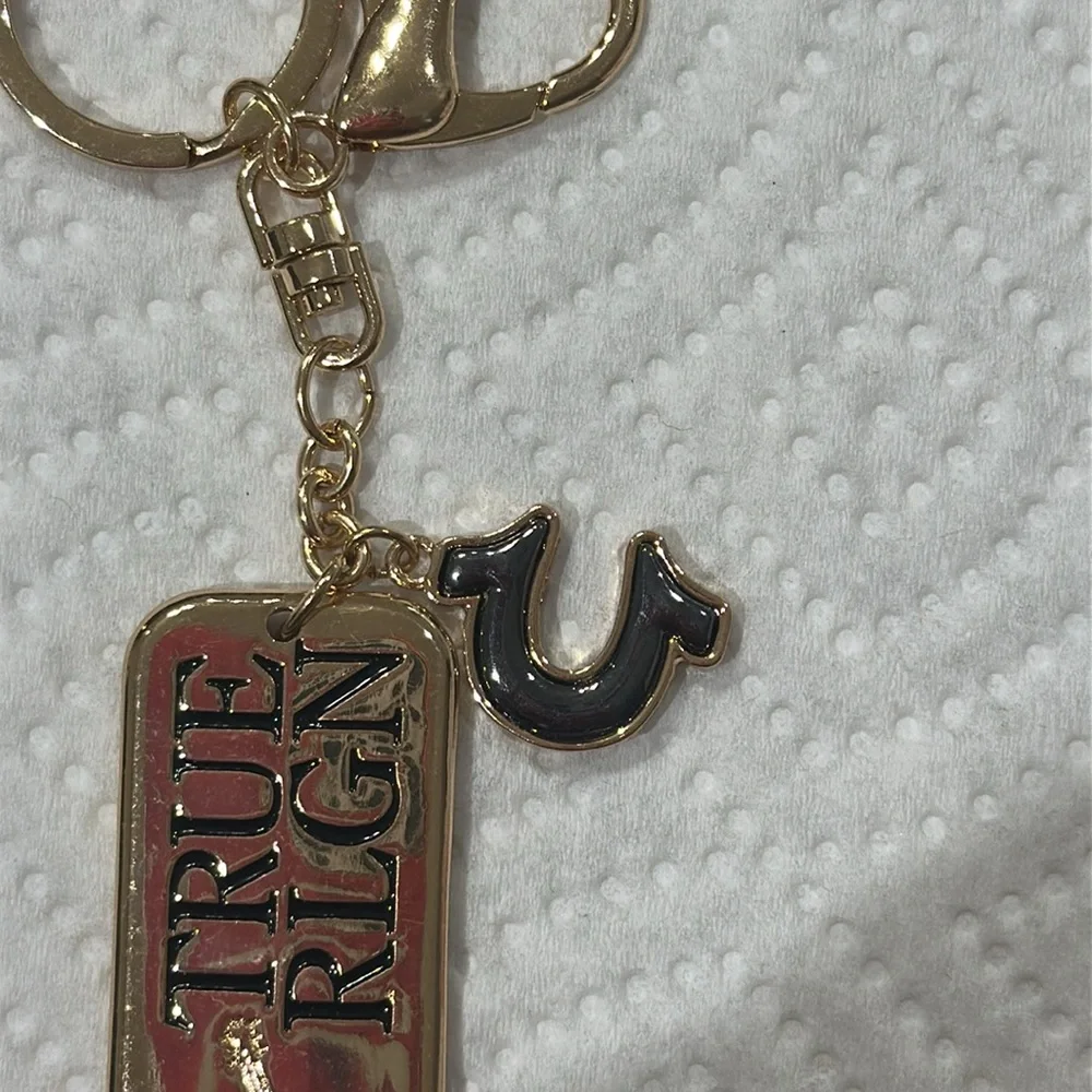 True Religion Gold and Black Keychain NEW